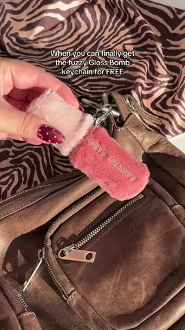 She got that Gloss Bomb with the fur 💖 Mark your calendars because EVERYTHING is 30% OFF for Black Friday on the #fentybeauty site from 11/26 to 11/30 💅🏽💅🏿💅🏻  Keep your Gloss Bomb warm & cozy with this fuzzy Gloss Bomb keychain as a FREE gift with purchase on orders of $125+ 🛍️ 