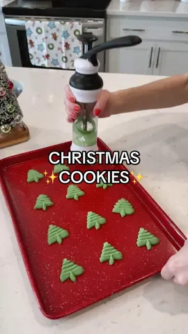 **Linked in my Amazon Storefront (in my bio) under “Christmas Kitchen”🎅🏻🍪 No more messy floured counters, rolling pins or cookie cutters! This cookie press makes Christmas cookie making ridiculously easy! Just use your favorite sugar cookie recipe (I dyed some of mine green for these fun Christmas trees and Grinch hearts) and put it into your cookie press. Comes with 14 cookie shapes (I also bought an additional Christmas pack) ✨3 Pro tips for using the cookie press: use an UNgreased cookie sheet, don’t used chilled dough (let it sit until closer to room temp or it won’t stick to the pan as well), and make sure you hold onto the cookie sheet when you release the press. #christmascookies #cookiepress #christmashacks #cookiehack #bakinghack     