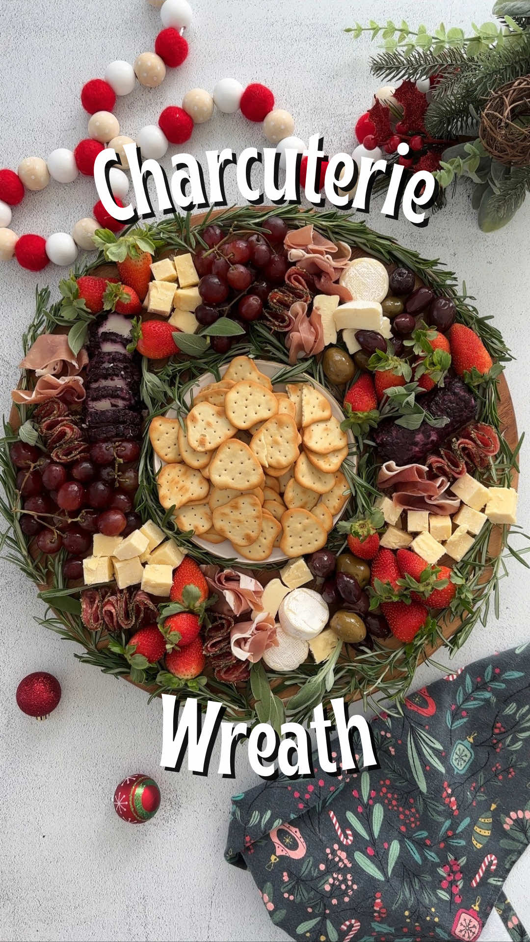 This festive charcuterie wreath, or charcuter-wreath 😆, is the perfect festive appetizer for the holidays! INGREDIENTS  • Blueberry Goat Cheese  • Mini Brie Wheels • Herb Crusted Salami • Prosciutto  • Cubed White Cheddar Cheese • Olives • Grapes  • Strawberries  • Naan Crackers • Fresh Rosemary  #charcuterieboard #christmassnacks #christmascharcuterie 