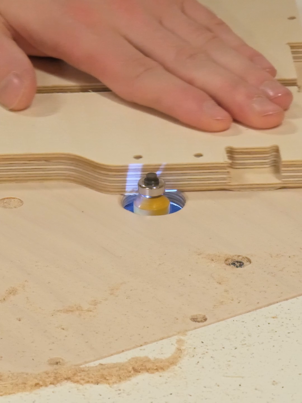 It’s time to get the parts ready for assembly ⚒️ To make sure there are no sharp edges and all the components feel nice to work with, we run a few passes with the trim router. Since our workbench has a built-in router table, this part is super easy — just take a piece from one pile, clean up the edges, and drop it into the finished stack. No extra movement needed. More on the Modular Cabinet project soon 😌 #routercnc #routerwood #trimrouter #routertable #cncparts 