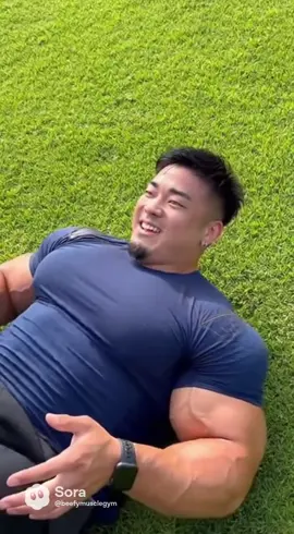 Grass Gains 💪🌿 Lying back on the grass, this beefy warrior crushes his hip workouts — strength in every move. #beefy #bulk #hunk #massive #pecs 