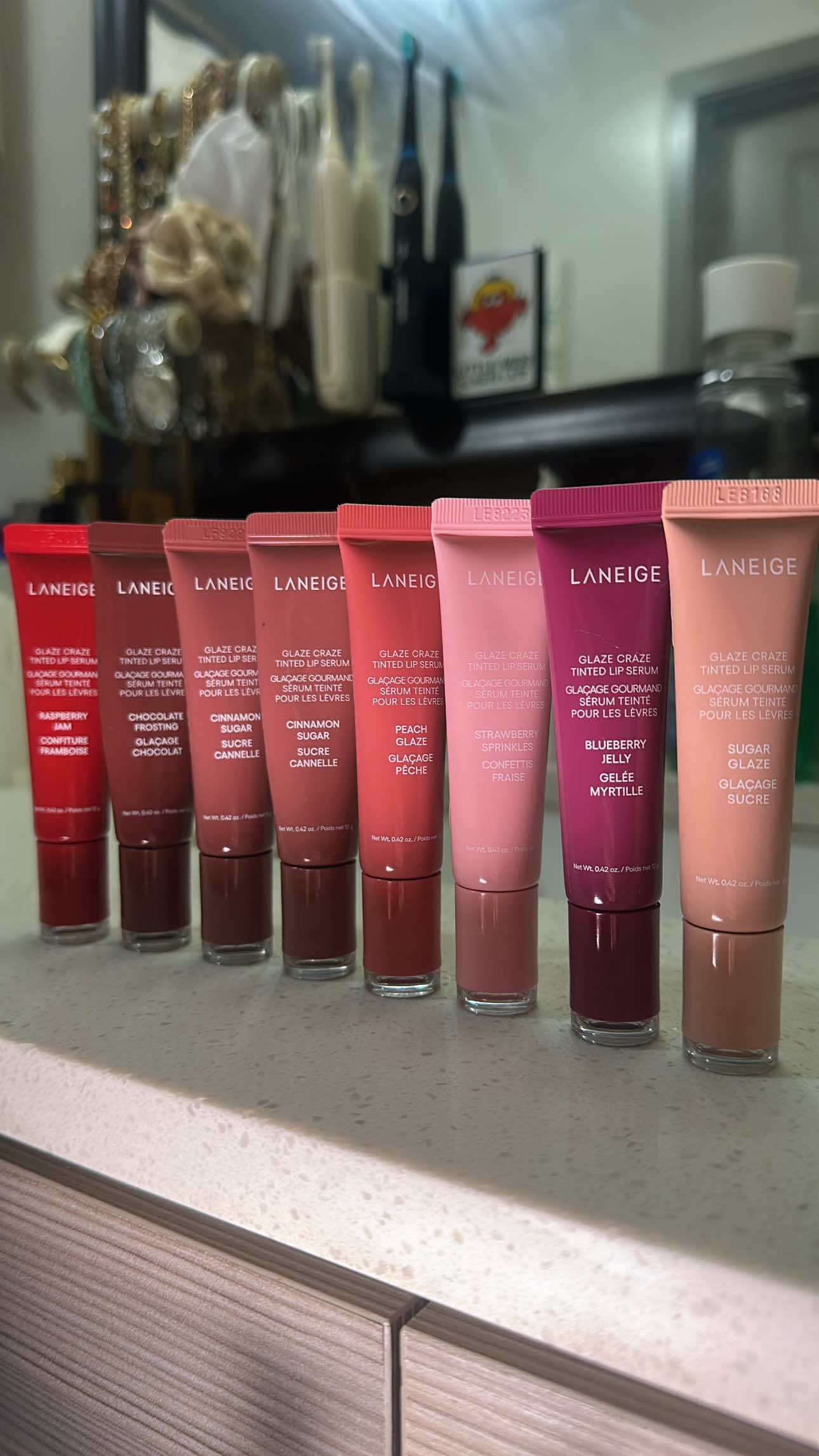 💖 OBSESSED is an understatement! 💖 I finally got my hands on the Laneige Glaze Crazed Tinted Lip Serum collection and let me tell you, the hype is REAL. ✨ These lip serums are seriously everything: Smooth like butter (no stickiness!) They taste and smell incredible (The Cinnamon Sugar and Strawberry Sprinkles scents are chef’s kiss 💋) The color shades are just so cute and tinted! Seriously, if you’re thinking about it, RUN, don’t walk! This is the best purchase I’ve made lately! My lips feel plump, hydrated, and absolutely fabulous. Time to stock up on all the shades! 🛍️  @laneige_us sponsor me please 🥹  #fyp #beauty #productreview #lipcombo 