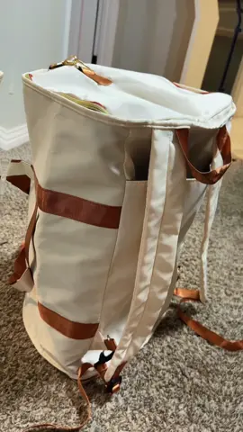 This carry-on duffle garment bag is actually genius 😭✈️ it folds out so everything stays flat and somehow still fits like a normal duffle. #carryongarmentbag #duffletravelbag #travelessentials #weekendtripbag #tiktoktravel