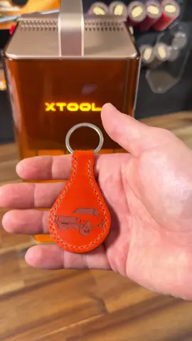 Using our F2 to laser a keychain @xtoolofficial #xtoolf2 #leatherasmr #leatherwork #laser #asmr