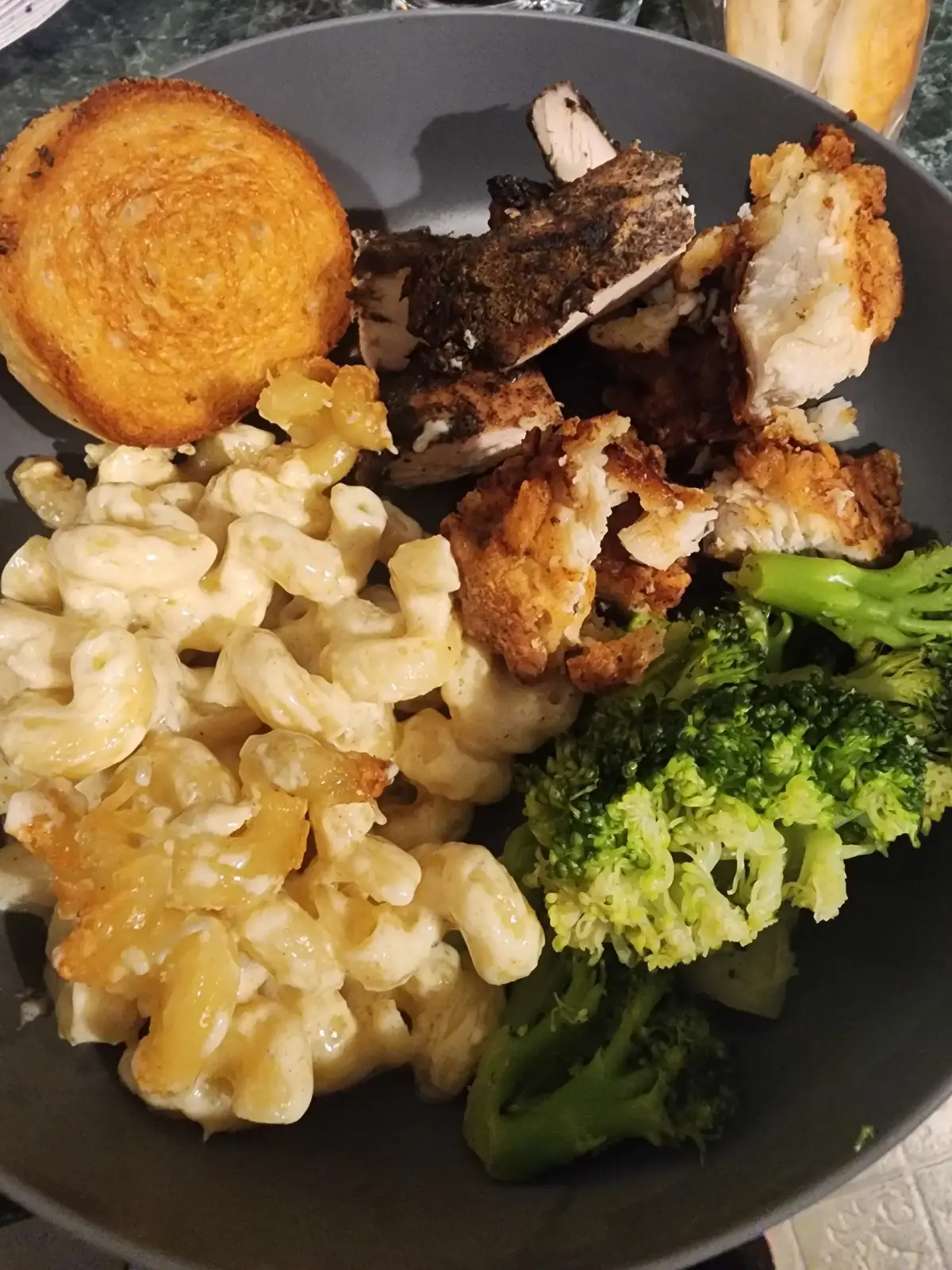 baked Alfredo  1 stick butter  3 tablespoons cream cheese  1 1/2 pints heavy cream  garlic 2 cups parmesan cheese  garlic powder pepper 1 box pasta  cook noodles till almost done drain and set aside. Melt butter in a pot add garlic and cook for 4-5 minutes. add cream cheese and stir till melted add heavy cream and bring to a simmer.  once warmed add parmesan cheese and seasoning cook till cheese is all melted. add noodles and transfer to a baking dish can top with more parmesan if wanted and bake for 20-25 minutes at 350°. chicken bites 2 chicken breast  flour season salt  pepper garlic and onion powder  lemon pepper seasoning  garlic herb seasoning  2 eggs  1/2 cup milk  hot sauce  cut chicken into pieces and put in a bowl with the eggs milk hot sauce and seasonings. let sit for about an hour. in a ziplock bag add flour and seasoning how ever much you like to use.  add chicken to bag and shake till chicken is coated may need to do this set a few times. I fry them in a pan till they are golden and fully cooked about 8 minutes. once cooked I put them on a paper towl lined baking sheet and keep them in the oven till warmed. repeat till all is cooked.   I served this with broccoli and homemade garlic herb bread.   #follow #deliciousfood #fypage #bakedalfredo  #chickenbites 