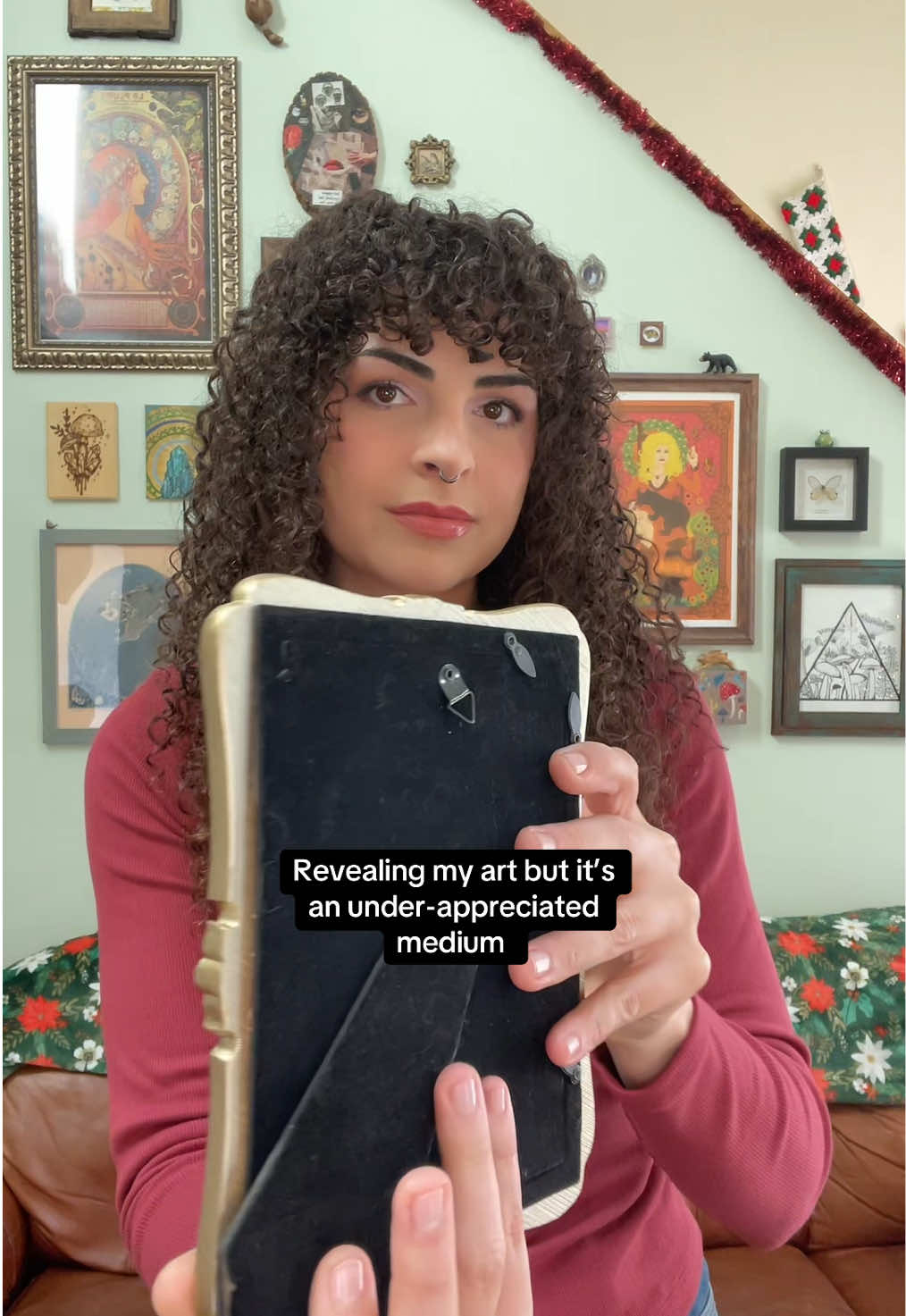 Trying this trend with art that can’t exactly do a spin reveal! 😅 Lol I’m not used to seeing myself on the screen like this. Trying to show face here more because human artist are important & all of that, especially in this age. But I’m definitely gonna be a little awkward about it. (Side note, I just found out someone is using clips of my work to sell a completely AI generated book of jewlery making tutorials. That feels so icky.) Anyway, here’s a butterfly pendant I made a couple of weeks ago! 🥰 She’s currently still available if she speaks to you. I’m kinda loving displaying it in this frame in the meantime. 🦋 #wirewrappedjewelry #handmadejewelry #artreveal #butterfly #wirewrappedcrystals 