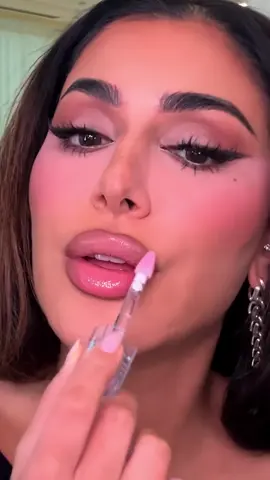 Spilling one of @Huda's fav lip combos! 💄Start with Lip Contour 2.0 in Warm Brown 👄Add a dab of Easy Blur Foundation ✨Top off with the glossiest, sweetest shade ever: FAUX FILLER Lip Gloss in UUU-BABY Grab all your favs for up to 80% off only at HudaBeauty.com 💖 #makeuptok #satisfyingvideo 