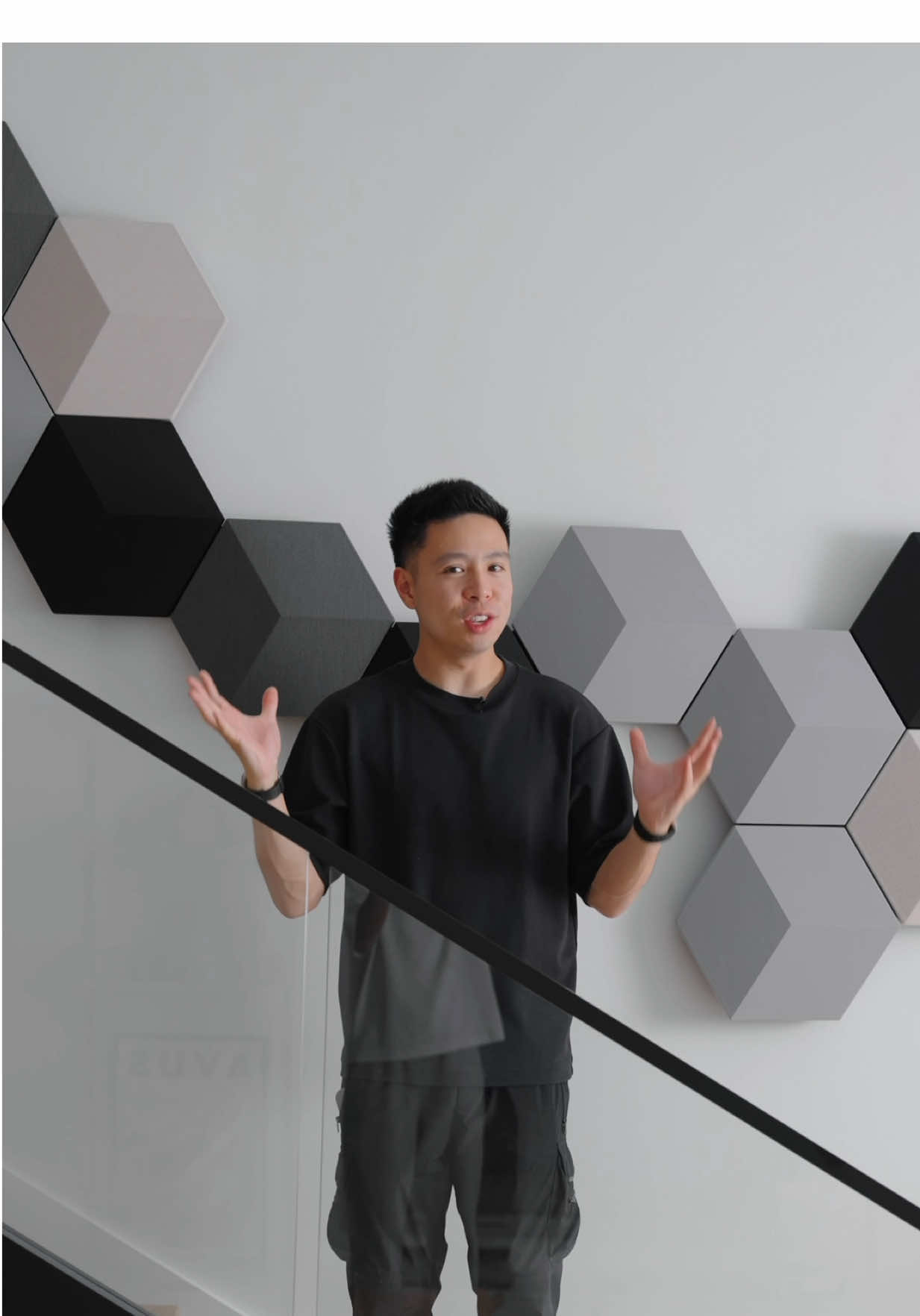 The @Bang & Olufsen Beosound Shape installed in my Tech Loft project instantly became the centerpiece of the space. It’s a speaker that feels architectural—clean lines, geometric symmetry, and a layout designed specifically for this wall. I partnered with the B&O Vancouver showroom, laying out the tiles physically, testing textures, and working with their team to finalize the arrangement and installation. This is a fully modular, wall-mounted speaker system designed by the user, and the online configurator lets you experiment with endless tile patterns and colour palettes to create what essentially becomes a piece of digital wall art. Beyond the aesthetics, the system itself is incredibly advanced. Each configuration can combine speaker tiles, a powerful built-in Class-D amplifier, and acoustic dampening panels that help tune the room. Depending on the design, the system can scale up to 44 tiles powered by up to 11 amplifiers, allowing both small and large layouts to perform equally well. Everything connects wirelessly through AirPlay, Chromecast, Bluetooth, and the Bang & Olufsen app, adapting its sound profile to the space and creating a wide, immersive sound field—without ever looking like a traditional speaker system. A perfect blend of customization, performance, and design. #Tech #Home #design