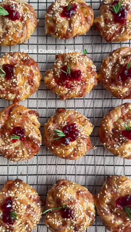 24 Days of Christmas Appestizers Pt 7 🎅🎄 Feta & Cranberry Swirls  1 x sheet puff pastry  200g Feta  120g grated mozzarella  1/2 tsp dry mint or oregano  1 x egg separated (mix the white with the cheese and the yolk with tsp milk for brushing  Sesame seeds  Honey  Cranberry Sauce Rosemary   Preheat oven to 180C and line a baking sheet with parchment paper. Crumble Feta really well and mix your cheeses and herbs with the egg white, spread over the top half of the pastry and fold it over. Press and smooth it down. Cut strips (I use a pizza cutter and made them about 1cm thick)  Take each strip and twist it and then roll it up as shown in the video. Brush with egg wash, add sesame seeds and bake for 30-33 min till dark golden on low shelf in the oven. Don’t be tempted to take it out before even if it looks golden, hang tight for a better bake. Enjoy hot or cold  D 🫶 #fyp #christmasfood #appetizer #partyfood #puffpastry 