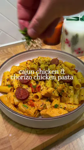 Cajun Chicken & Chorizo Pasta 🤍 Serves 2: 2 diced chicken breasts 150g dried pasta  150ml chicken stock 100ml single cream 60g chorizo 1 onion 1 red pepper 1 tbsp tomato puree 1 tbsp garlic paste Fresh parsley  Seasoning 1tsp garlic and onion granules, oregano & 2tsp Cajun seasoning - Slice your chorizo up and fry for 2 mins on each side and set aside - season your chicken in the above seasoning (only 1 tsp of Cajun at this point) then set aside - fry your onion and pepper for 10 mins or u til softened then add your chicken and cook u til almost cooked, add your garlic and tomato paste and cook for a further 1 min - add your chicken stock and single cream and  give it a good stir then add another tsp of Cajun and allow to simmer, at this point put your pasta onto cook as per instructions  - 5 mins before pasta is ready add minced up fresh parsley then once pasta is cooked add 2 tbsp of pasta water to the pan to loosen the sauce then add your pasta and then the heat off and top with your chorizo and serve #mealideas #pastatiktok #EasyRecipes #simplerecipe #DinnerIdeas 