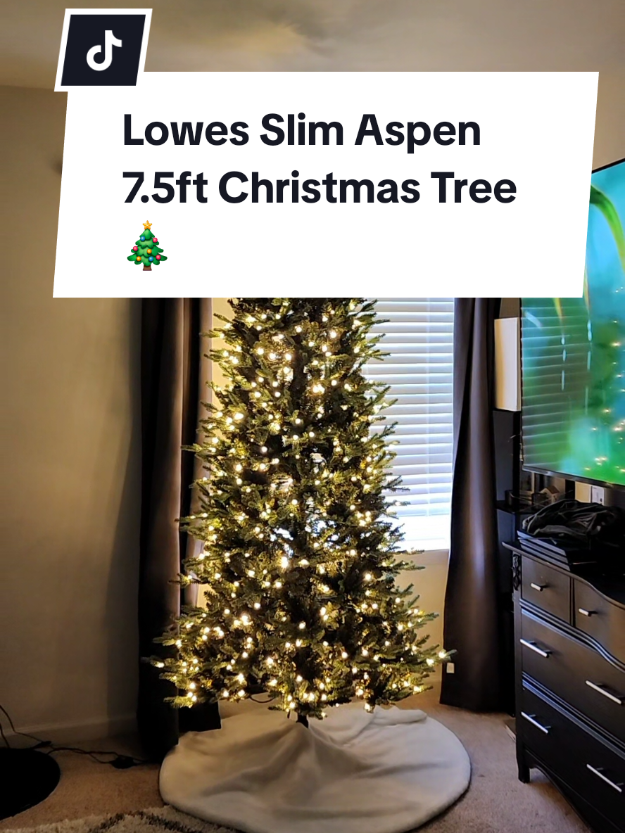 Not one of the viral trees but it's so pretty! No fluffing needed and it's super easy and quick to put together! #loweshomeimprovement #lowes #christmastree #viralchristmastree #slimchristmastree @Lowe’s 