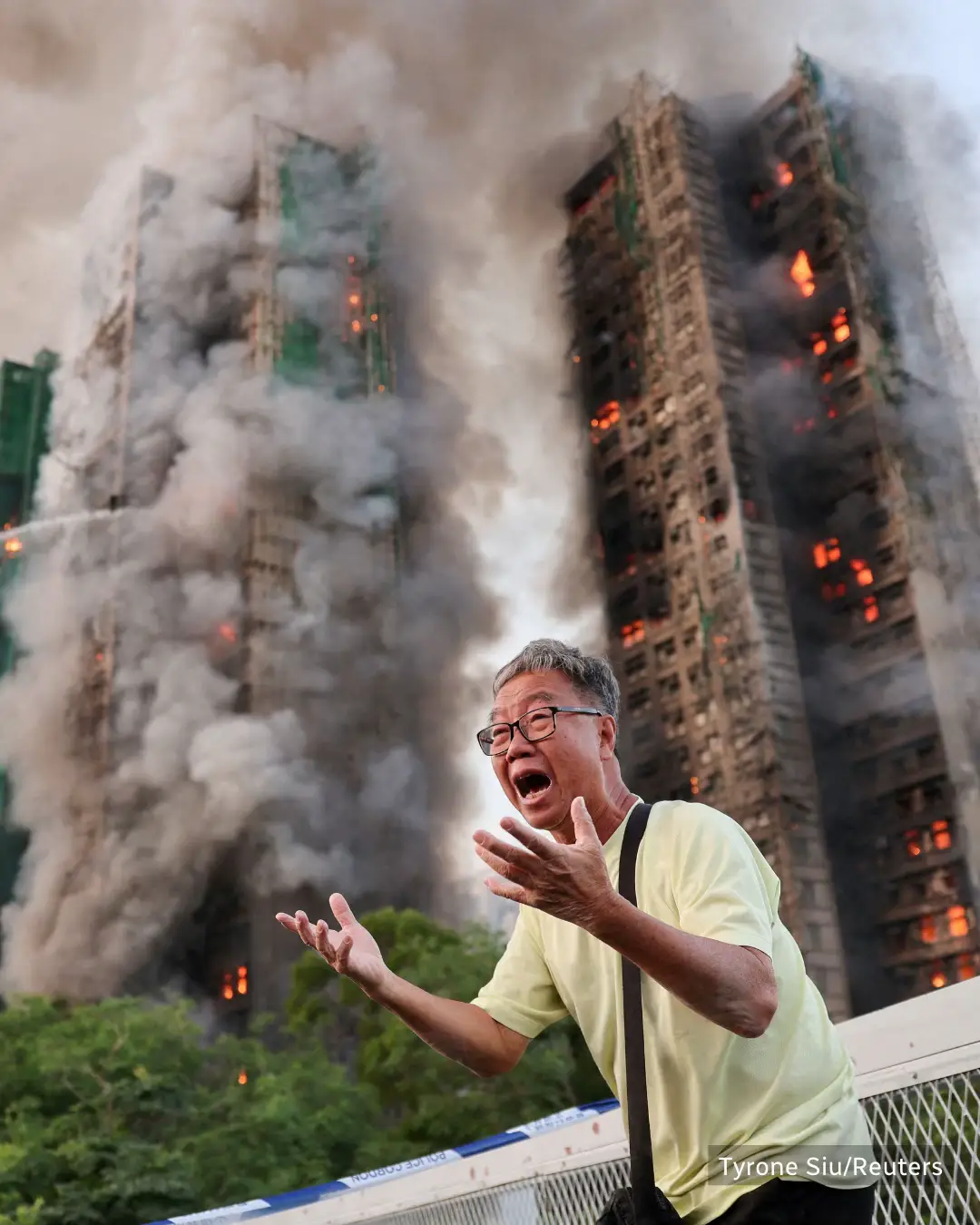 A fire spread across multiple highrise buildings in a Hong Kong housing complex on Wednesday, killing at least 13 people and leaving others trapped inside, authorities said. About 700 people have been sent to temporary shelters. #HongKong #Fire #Rescue #News #Moment