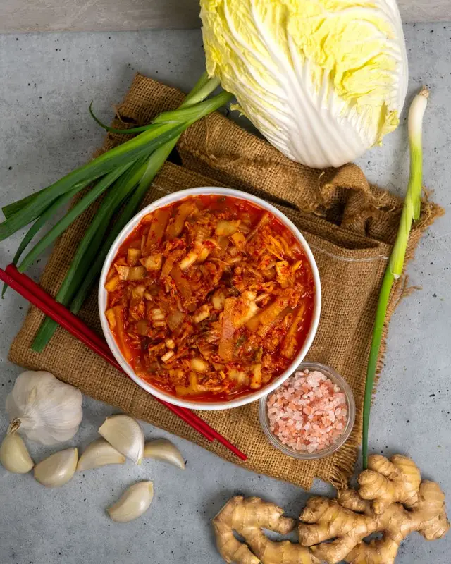 Napa cabbage + garlic + ginger + green onions + Melissa’s Korean Chili Flakes = the flavor bomb your fridge has been missing. Fermented, crunchy, spicy, and good on literally everything—rice bowls, breakfast eggs, ramen, quesadillas… you name it. Want the full step-by-step?
