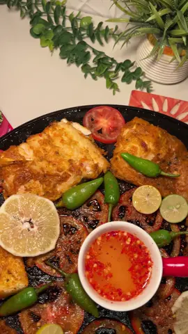 KPK-Style Tawa Fish 🐠  Step 1: Remove Raw Fish Smell 	1.	In a bowl add: 	•	1 tablespoon salt 	•	1 tablespoon garlic (crushed/paste) 	•	3 tablespoons vinegar 	•	Enough water to soak the fish 	2.	Dip the fish in this mixture for 30 minutes. 	3.	Take it out and pat dry. Step 2: Make the Marinade In a mixing bowl add: 	•	7–8 tablespoons besan (gram flour) 	•	4 tablespoons cornflour 	•	1 teaspoon salt 	•	A pinch of food color (optional) 	•	National Foods Fish Recipe Mix (to taste) 	•	1 tablespoon coriander powder 	•	Juice of 2–3 lemons 	•	Water as needed to form a thick paste Mix until smooth. Step 3: Marinate the Fish 	•	Coat the fish thoroughly with the marinade. 	•	Let it rest for 1 to 1.5 hours. Step 4: Optional Pre-Frying 	•	Lightly fry the fish for 2–4 minutes to seal the coating (optional but helpful). Step 5: Cook on the Tawa 	1.	Heat 3–4 tablespoons oil on a tawa. 	2.	Add round-cut tomato slices to the tawa. 	3.	Place the marinated fish on top of the tomatoes. 	4.	Top with: 	•	Green chilies 	•	A little salt 	•	A bit more fish recipe mix Cook until fully done and slightly crisp.