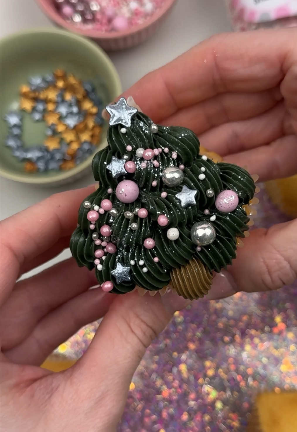 YOUR SIGN to make these cute Christmas tree shaped cupcakes! 🎄🩷 Made by @Judit Balázs using our new Super Streusel sprinkles! Available at The Cake Decorating Company!  #bakingtok #christmasbaking #christmas #christmascupcakes #shapedcupcakes 