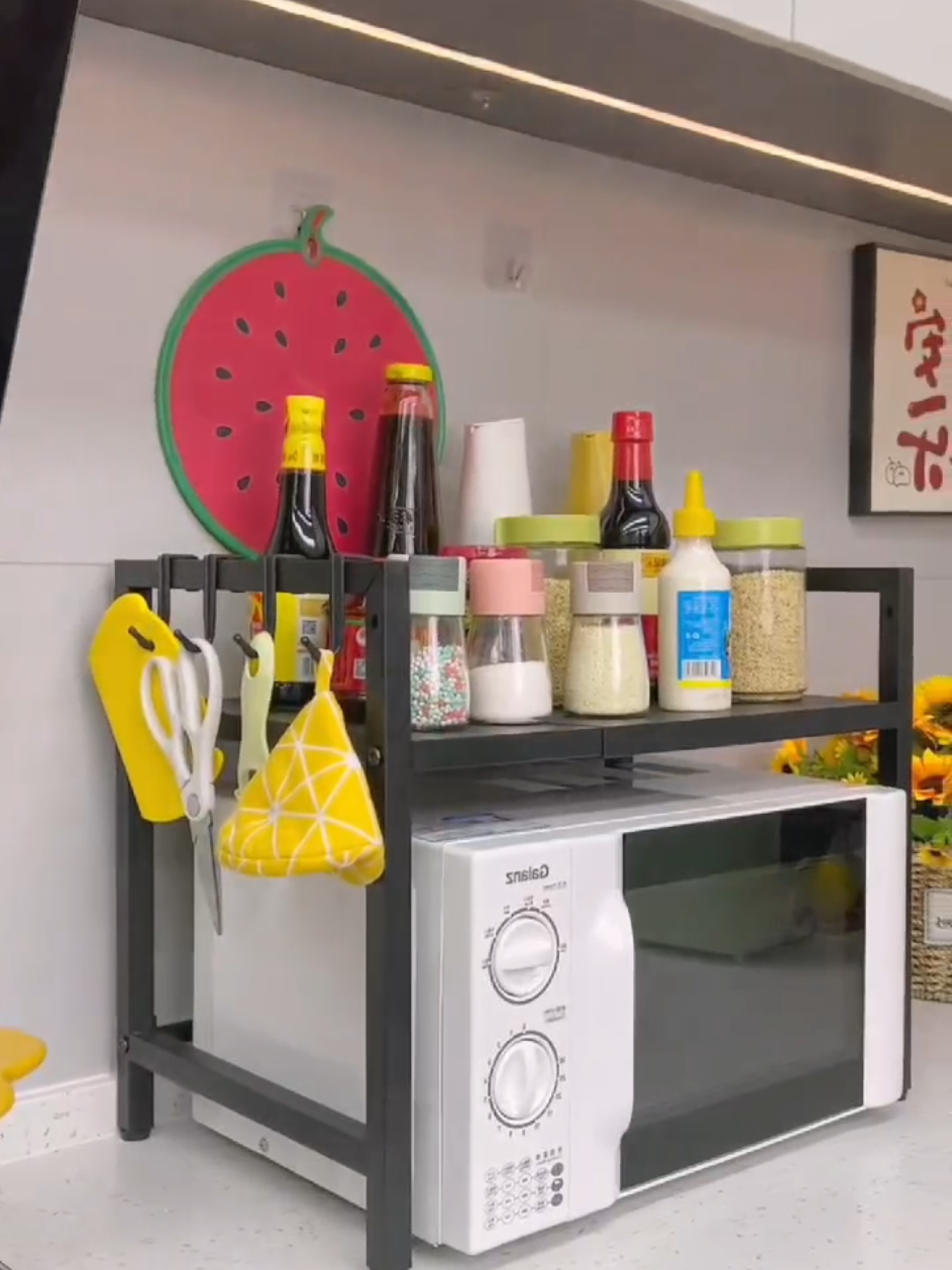 O Maximize your kitchen space with thisRetractable Microwave Oven Rack- -a true game -changer for small spaces!