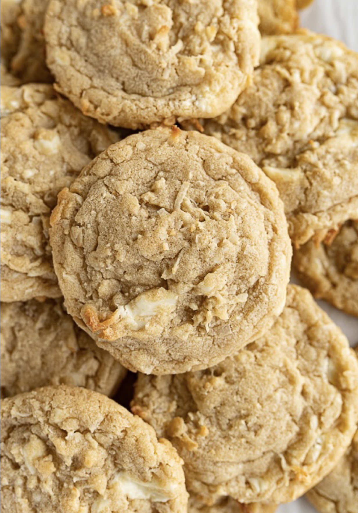 If you’re craving sunshine in the middle of sweater season, these Coconut Cookies are it. Toasty coconut + melty white chocolate = instant vacation vibes without booking a flight. Add them to your Christmas cookie lineup for a unique, bright, crowd-pleasing treat! Day 35: White Chocolate Coconut Cookies 🎄 Don’t miss my Christmas Cookie Series, follow along! Find the full recipe on my blog by searching ‘butter coconut cookies’ using the link in my bio  ✨  Recipe can also be found on page 106 of my cookbook, Cookies for Days!💕 coconut cookies | christmas cookies | holiday baking | festive treats | white chocolate | tropical cookies | cookie exchange | cozy baking
