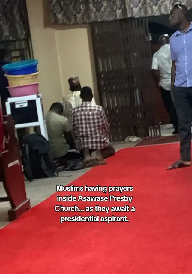 Muslims having prayers inside Asawase Presby Church.. as they await a presidential aspirant.