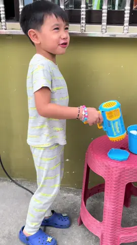 Happy kiddo with his new toy bubble machine #bubble #bubblemachine #bubblegun #toys #fyp 