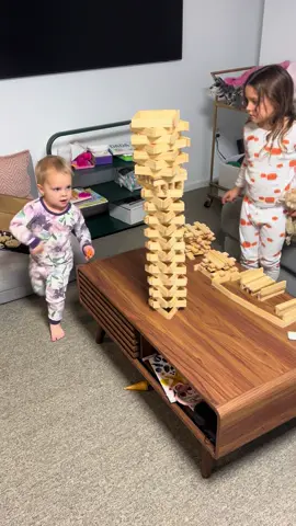 she knew exactly what she was doing 😅 #littlesistersoftiktok #toddlersoftiktok  (Dad built the tower and said they could knock it down, she got there first!)