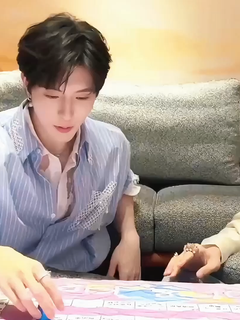 bros are playing monopoly but not really, except they're no bro. lol.