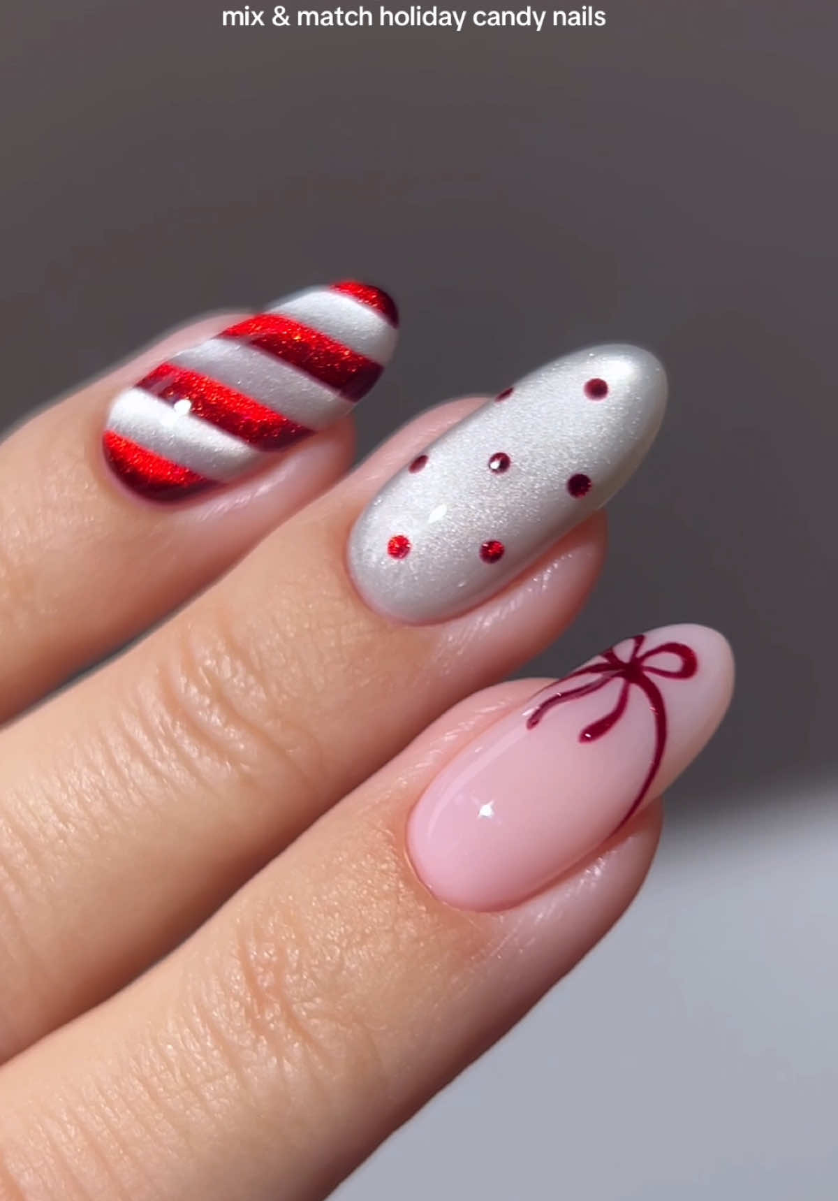 🎅🏼🌨️🧣 glossy candy cane ribbons and tiny polka dot sprinkles coming together for the cutest mix & match moment ✨🍬 *all products are linked on my amzn in the bio _____ *affiliate #christmasnails #rednails #glitternails #holidaynails #nailinspo 
