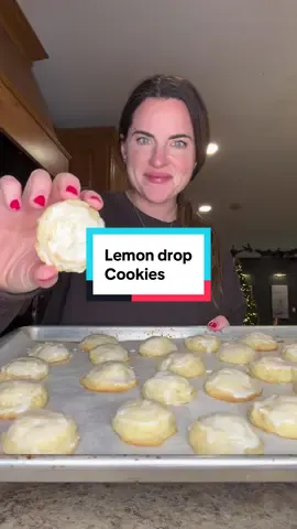 Lemon Drop cookies! Episode 29 of my Christmas cookie series! Ingredients: 2 & ¼ cups all purpose flour  1 teaspoon baking powder ¼ teaspoon salt  1 cup granulated sugar 2 lemons, zested ¾ cup unsalted butter, room temperature 1 large egg 1 teaspoon vanilla extract 1 tablespoon lemon juice  Lemon Glaze 1 & ½ cups powdered sugar 3 tablespoons lemon juice How to: Start by adding granulated sugar and the zest of two lemons in a mixing bowl. Mix until well combined. Add in softened butter and mix well. Add in egg, vanilla extract, and lemon juice and mix well. In a separate bowl combine flour, baking powder, and salt. Mix in with dough until mixed together.  Chill dough 1 hour. Scoop dough onto a parchment lined pan using a 1 inch cookie scooper. Bake at 350 degrees for 11-13 minutes. Let cool.  Mix ingredients for icing together and top cooled cookies. Made 25 cookies! #lemon #christmascookies #cookierecipe #baking #cookies 