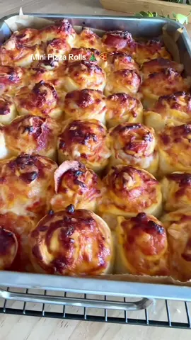24 Days of Christmas Appetizers Pt 10🎅🎄 Mini pizza rolls (not just for Christmas) these are great for lunchboxes too, freeze as soon as cool and defrost in a few hours airtight. You can use shop bought pizza dough or my tutorial for mini pizza is at the top of my page  Dough: 300ml lukewarm water  7g instant yeast  1/2 tbs sugar  20ml olive oil  500ml bread / strong flour  1/2 tbs salt  200g grated mozzarella  Pepperoni or salami  Pizza sauce  Mix: 1 x tin plum tomatoes (or a tube of tomato puree mixed with about 250-350ml water or same amount of tomato passata) 1 tbs tomato puree  3 garlic cloves Crushed or chopped  Salt & pepper  Whisk lukewarm water and yeast together, add sugar and whisk again. Add the oil, flour and salt and mix until roughly combined. Knead on a lightly floured surface for 5-10 minutes (10 is best if you can) cup the dough, drag it towards you to form a tight ball. Lightly oil a clean bowl and rub some oil over the dough. Place it inside and cover and rest for 60-90 minutes. Add some parchment paper to a roasting dish’s  Decompress the dough take it out and then place it on a l floured surface (this is important as when you roll it out you don’t want the dough to completely stick to the surface. Roughly shape it into a rectangle before rolling it out. To get the shape roll lengthways, width ways and diagonally. A dough scraper or metal spatula can help you shape it by pushing in the edges. It should be about 2mm thick.  Spread pizza sauce and add cheese. Cut in half lengthways and then into strips about 1 inch wide. Add your meat to each strip and roll up. Add to your dish and cover and rest 30 min.  Preheat your oven to 200C Bake until cooked (it will depend on your oven. Mine took approx 20 min  Enjoy D 🫶 #fyp #minipizza #pizzarolls #partyfood #appetizer 