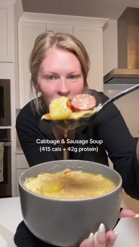 Cabbage & Sausage Soup🍲💕 (415 cals + 42g protein) This recipe makes (6) 3.5 cup servings;  - 64 oz(s), Kettle & Fire Chicken Bone Broth - 2 medium, Onion - 8 links, Andouille Chicken Sausage - 1 cup, Low Fat Good Culture Cottage Cheese - 1 can (15 oz), Canned Cannellini Beans - 2 large, Carrots - 0.25 each, Green Cabbage - 2 tbsp, Olive oil - 3 Bay Leaves (remove after cooking)  - 3 large, Golden Yukon Potatos  - Season to taste with salt, peppercorn, paprika, and Italian Herb seasoning. #healthy #protein #soup #dinner #mealprep 