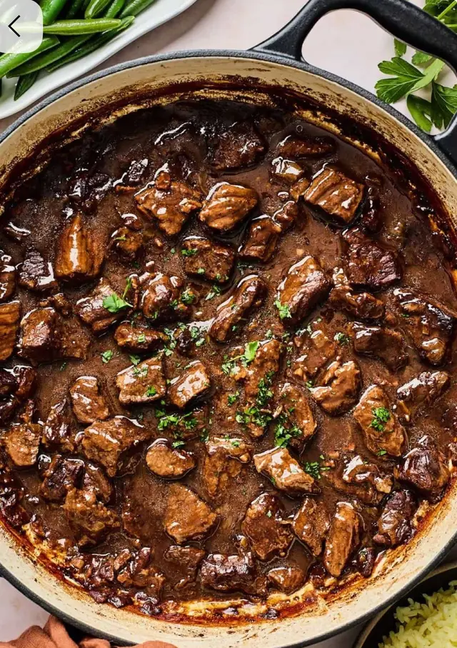 Beef Tips and Gravy Ingredients 	•	1.5 pounds beef stew meat or sirloin, cut into cubes 	•	2 tablespoons olive oil or butter 	•	1 small onion, chopped 	•	2 cloves garlic, minced 	•	3 cups beef broth 	•	2 tablespoons Worcestershire sauce 	•	1 teaspoon onion powder 	•	1 teaspoon garlic powder 	•	1/2 teaspoon black pepper 	•	1/2 teaspoon salt (adjust to taste) 	•	1 teaspoon dried thyme or dried parsley (optional) For thickening the gravy: 	•	3 tablespoons flour 	•	3 tablespoons cold water Instructions 1. Brown the beef Heat oil in a large skillet or pot over medium-high heat. Add beef cubes and brown them on all sides. Remove beef and set aside. 2. Cook the onions and garlic Add onions to the pot and cook for 3–4 minutes. Add garlic and cook for 1 minute. 3. Build the gravy Add the beef back to the pot. Pour in beef broth and Worcestershire sauce. Add onion powder, garlic powder, salt, pepper, and thyme (if using). Stir and bring to a boil. 4. Simmer Cover the pot, reduce heat to low, and simmer for 30–40 minutes until beef is tender. 5. Thicken the gravy In a small bowl, mix flour and cold water until smooth. Slowly pour into the pot while stirring. Let simmer uncovered for 5–7 minutes until gravy thickens.