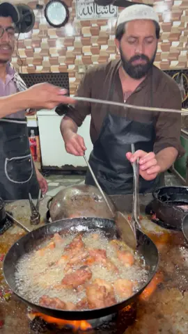 Chicken karahi with red tomatoes and hot oil