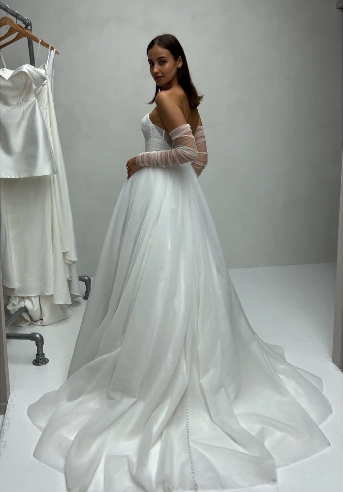 Off-the-shoulder tulle sleeves + a dipped Basque waist? Bridal perfection 🤍 #wed2b #basquewaist #sleeves #weddingdress #tulleweddingdress  
