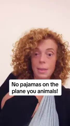 Yeah yeah yeah I know we’re not supposed to call those shirts wife be@ters but what else do you call them?? #comedy #michellewolf #standup #travel #airplane   