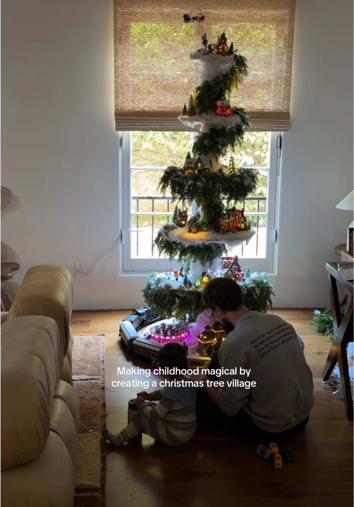 Magical childhood is loading… Jacopo built our boys a Christmas village tree, similar to the one he had as a kid. Teo has been asking for a moving train since last year so we finally got him a Christmas train! So excited to slowly collect more villages as our boys grow. #christmasdecorations #whimsical #xmasdecor #pinterestaesthetic 