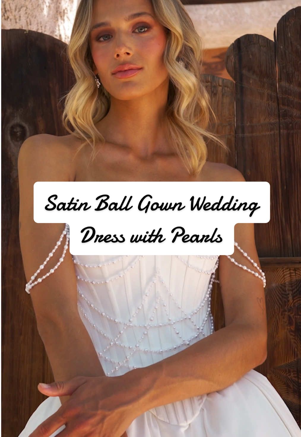 She’s elegant, dramatic, and absolutely unforgettable! ❤️ Her full skirt cascades in soft, sweeping layers, creating a show-stopping silhouette from every angle, while delicate, draped pearl strands fall gracefully from the off-shoulder neckline, blending Old Hollywood glamour with a modern, contemporary twist. Save Claramae now if she’s the one you’ve been waiting for! 😉 Wedding Dress Featured: Claramae LA26103 Dress Designer: L'amour by Calla Blanche #callablanche #simplewedding #weddingdressdesigner #satinweddingdress #weddingdress