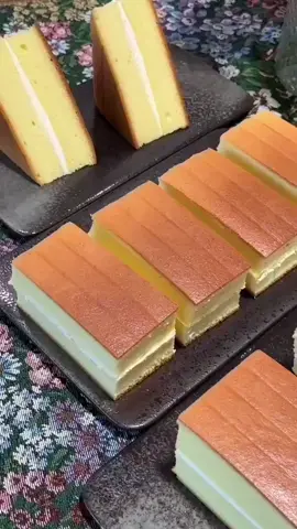 Delicious Orange Cake 😍 preparation take a bowl vegetable oil 90ml cake flour 110g mix well orange juice 110ml mix well egg yolks 8 mix well on a separate bowl cold egg whites 8 lemon juice 7ml sugar 70g vanilla extract your choice  mix well mix the two liquids baking pan 28x28x5cm baking paper baking sheet  with hot water in the oven  Bake in a preheated oven  150C for 60min let it cool cream preparation whipped cream 100g sugar 8g mix well cut the cake into two pieces add cream on the cake  cut the edge from the cake cut into pieces keep the cake in the refrigerator #cake #Recipe #fyp 