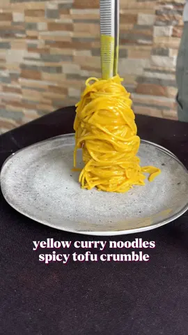yellow curry noodles with spicy tofu crumble x ingredients  -spicy tofu crumble 200g medium firm tofu 1 tbsp light soy sauce 1 tbsp sriracha 1/2 tbsp white vinegar 1 tsp smoked paprika 1/2 tbsp sesame oil 1 tsp chilli flakes 1 tsp msg (optional) - yellow curry noodles 1 tbsp sesame oil 1 tbsp thai yellow curry paste 1/2 cup coconut milk  1/4 cup water boiled noodles fried onions #veganfoodshare #veganrecipes #veganfood #veganeats #vegan         