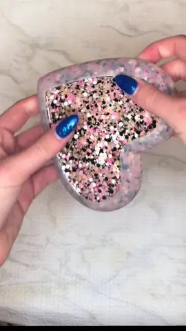 @Bee Glittery Glitter Supply one of my fav glitters! 🧡🩷🖤🤍  Heart dish demolding!! #resindemolding #resinmadebymegans #supportsmallbusiness #jewlerydish #satisfying 